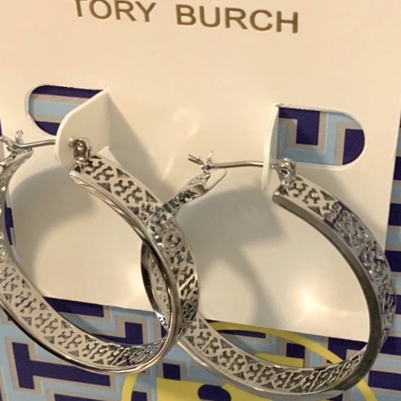 Tory Burch Jewelry - Tory Burch silver tone hoops with engraved logo around the gorgeous earrings